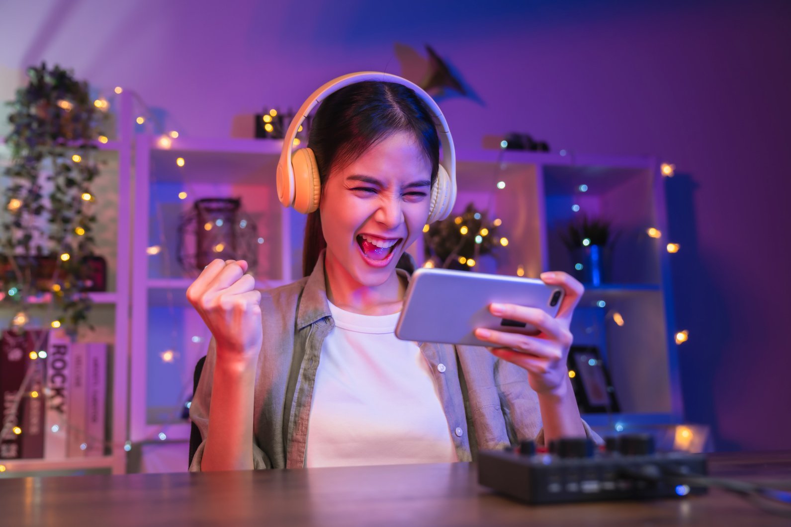 woman playing online game on smartphone